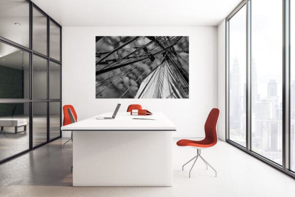 Office workspace with blank poster