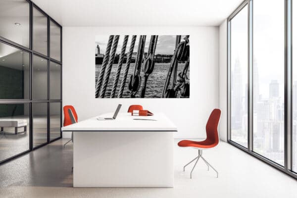 Office workspace with blank poster